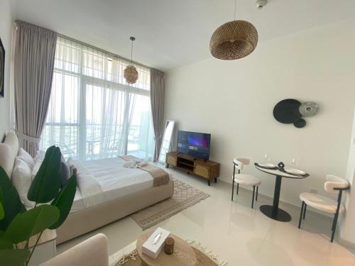 Modern DAMAC Hills Studio with Balcony, Gym & Pool