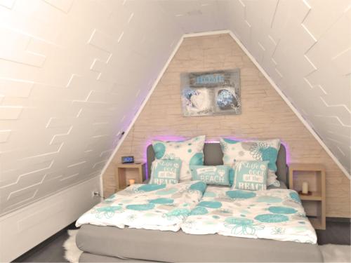 a bedroom with a bed in a attic at Garden Escape in Wernigerode in Wernigerode