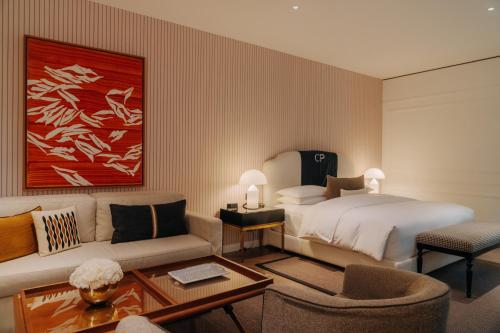 a hotel room with a bed and a couch at Casa Polanco Hotel Boutique in Mexico City