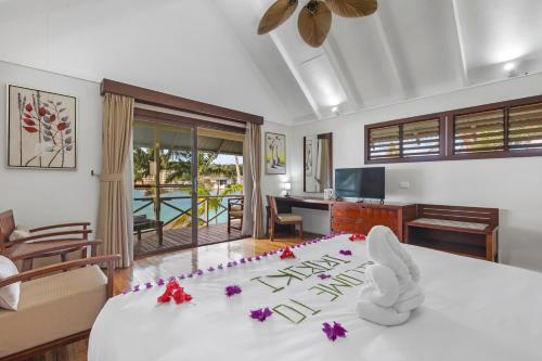 a room with a bed with flowers on it at Iririki Island Resort & Spa in Port Vila