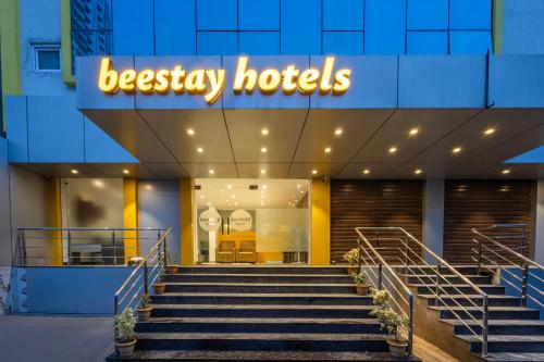 a hotel with stairs in front of a building at beestay hotels Near US Consulate in Hyderabad