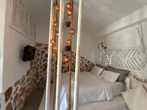 a bedroom with a bed in a room with a giraffe at Atlazia Suites in Alinda