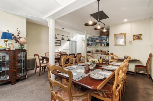 a dining room with a table and chairs at Margaret River Guest House in Margaret River Town