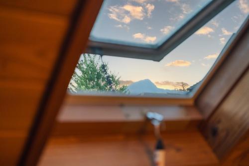 a window in a room with a view of the sky at Beppu RIN in Beppu