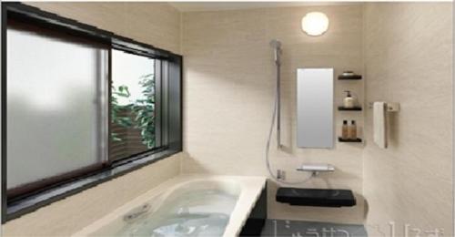 a bathroom with a bath tub and a window at 2-10-15 Imagawa - Apartment / Vacation STAY 7907 in Tokyo
