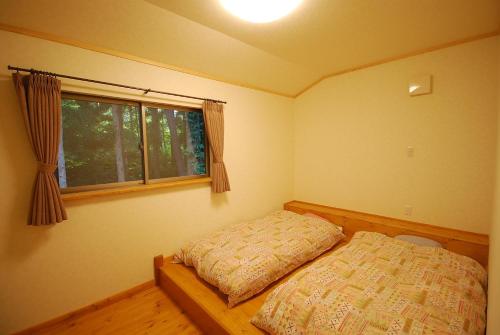 Un pat sau paturi într-o cameră la Cottage All Resort Service / Vacation STAY 8401