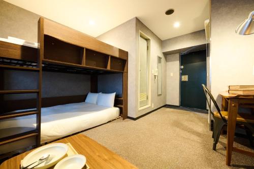 Ένα ή περισσότερα κρεβάτια σε δωμάτιο στο Sapporo - Apartment - Vacation STAY 29227v
