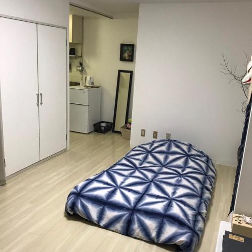 a living room with a bean bag chair on the floor at Room 202 / Vacation STAY 13909 in Tokushima