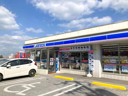 a white car parked in front of a store at Pension Marinetown Aratta Vacation STAY 13299 in Gaja
