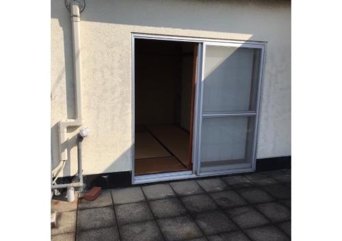an open door to a room in a building at Guest House Inujima / Vacation STAY 3516 in Toyama