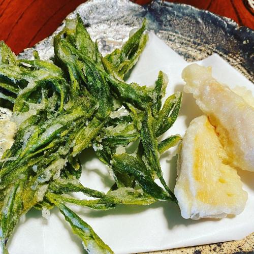 a plate of food with asparagus and a piece of bread at Tabinoya / Vacation STAY 17823 in Kakegawa