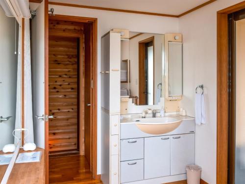 a bathroom with a sink and a mirror at Yamaen Enso / Vacation STAY 32534 in Atami
