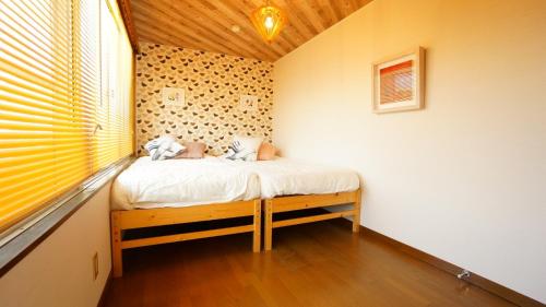 Giường trong phòng chung tại Takayama - Apartment / Vacation STAY 34383