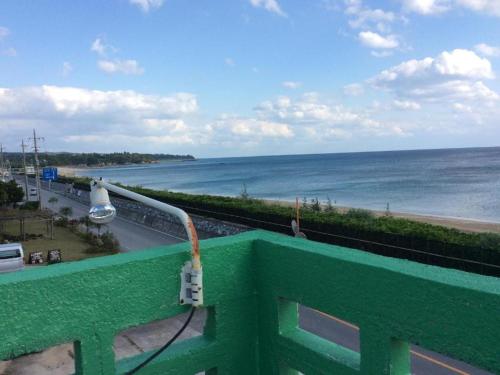 a view of the ocean from a balcony at Kunigami-gun - House - Vacation STAY 78177v in Higashi