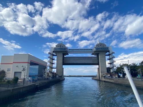 a bridge over a river next to a building at Minato Oasis Numazu - Vacation STAY 31031v in Numazu