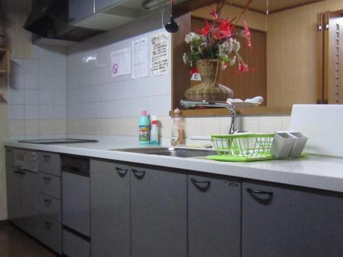 a kitchen with a sink and a counter with a sink at Minato Oasis Numazu / Vacation STAY 40706 in Numazu