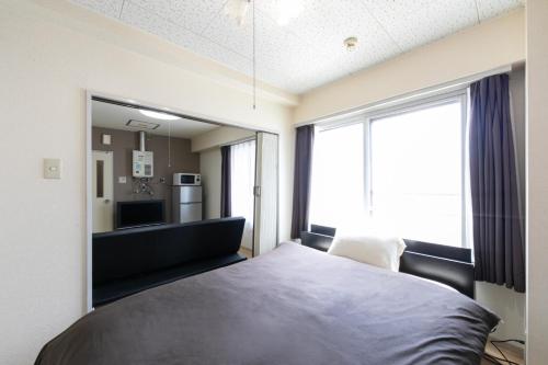 Postel nebo postele na pokoji v ubytování E-Horizon North 2 Building - Vacation STAY 17104