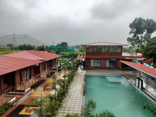 an overhead view of a resort with a swimming pool at Sandalwoods Resort in Neral