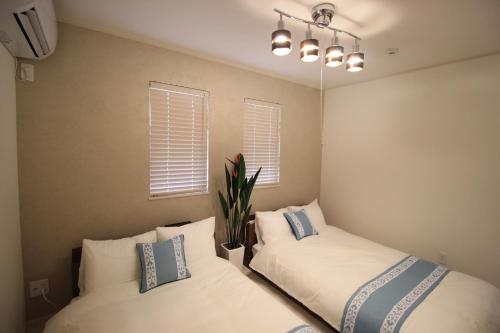 Postel nebo postele na pokoji v ubytování HOPE VILLA Onna-son - Vacation STAY 52857