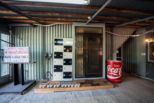 a coca cola machine in front of a building at Harbors - Vacation STAY 54826 in Beppu