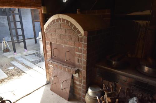 a brick oven with a door in a room at Kanakuraen / Vacation STAY 5125 in Marugame