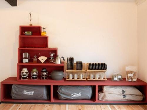 a red shelf in a room with various items at Camp-style inn Yamagara - Vacation STAY 41883v in Iwai