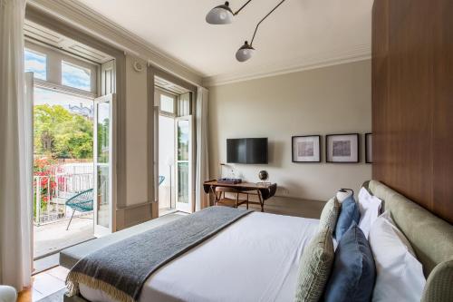 Katil atau katil-katil dalam bilik di Gallery Townhouse & Home