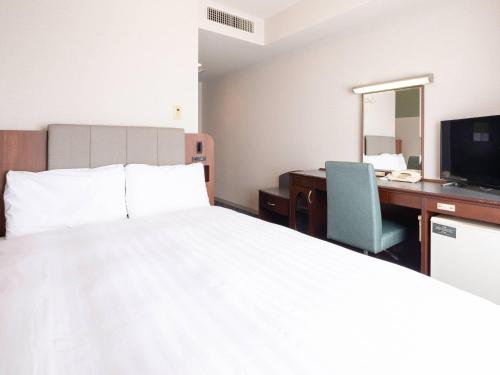 Letto o letti in una camera di Comfort Hotel Toyokawa