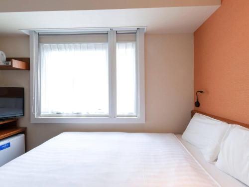 Letto o letti in una camera di Comfort Inn Tokyo Roppongi