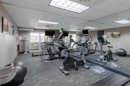a gym with several treadmills and elliptical machines at Comfort Inn & Suites Boulder in Boulder