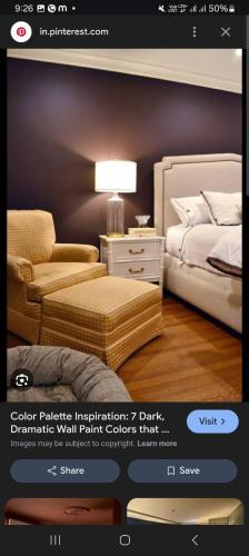 a page of a bedroom with a bed and a chair at Rose guest house in Anantnāg