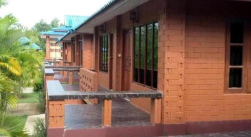 a building with a row of windows on it at Lomdao Resort in Udon Thani