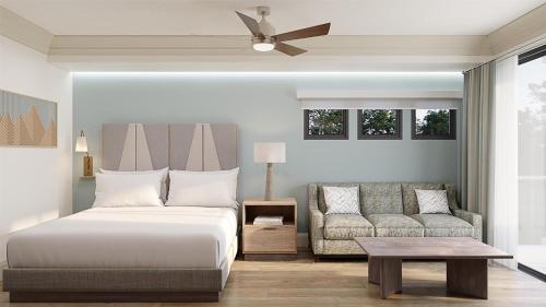 a bedroom with a bed and a couch at Hilton Vacation Club Mill Springs Lodge Pigeon Forge in Pigeon Forge