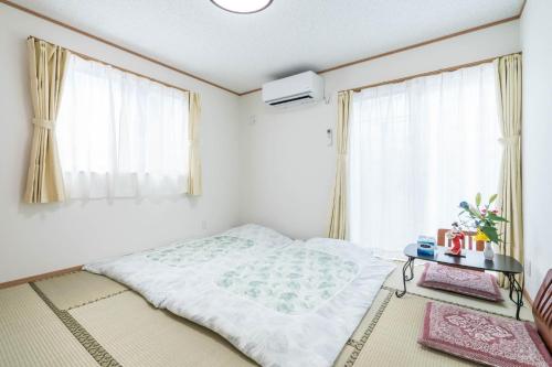 Postel nebo postele na pokoji v ubytování Travel Palace Miyuki (Yomiuri Shimbun) / Vacation STAY 5684