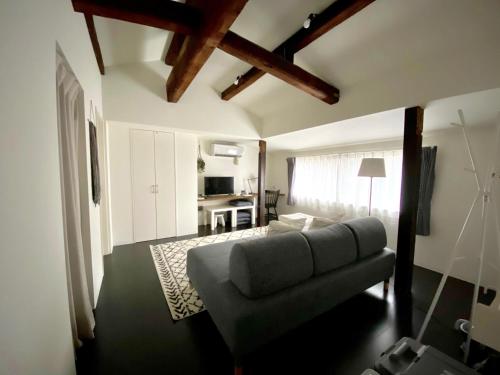 a living room with a couch and a table at Nagasaki - House / Vacation STAY 63873 in Nagasaki