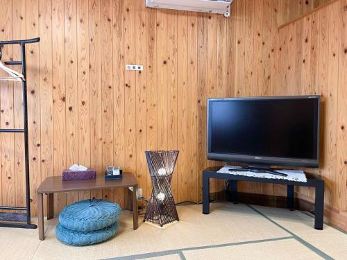 a flat screen tv sitting on a table in a room at SYUkuhaku matuenosato / Vacation STAY 65782 in Matsue