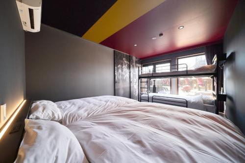 a bedroom with a white bed in a room at Rakuten STAY x EAGLES 102 with terrace in Sendai