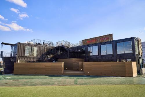 a building with a staircase in front of it at Rakuten STAY x EAGLES 102 with terrace in Sendai