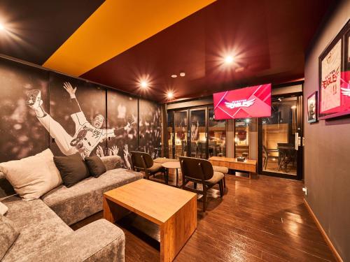 a living room with a couch and a table at Rakuten STAY x EAGLES 101 with terrace in Sendai