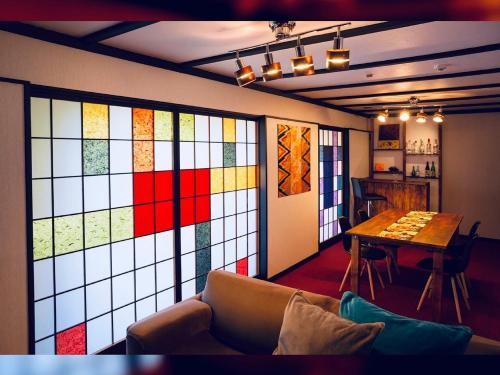a room with a wall of stained glass windows at Taisho Motor Wir zen - Vacation STAY 88575 in Hakone