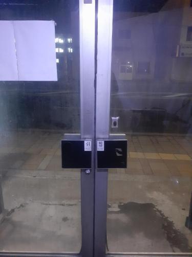 a glass door with a sign in a room at Hamburger restaurant Big foot / Vacation STAY 6626 in Hachinohe