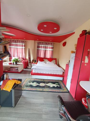 a bedroom with a bed and a red ceiling at Comfort Corner Homestay in Kathmandu
