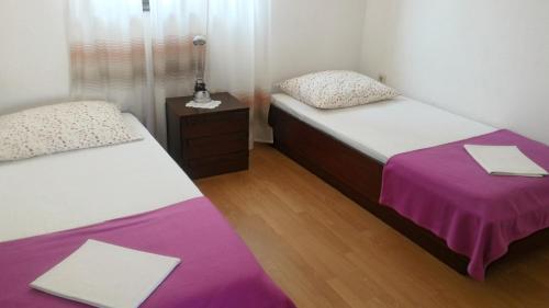 Posteľ alebo postele v izbe v ubytovaní Apartments Beceic