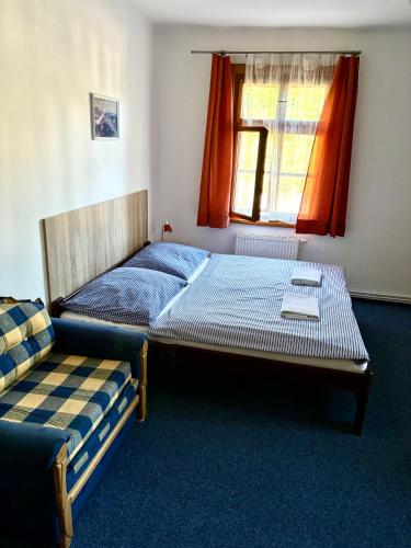 a bedroom with two beds and a window at Pension Bystřenka in Špindlerův Mlýn