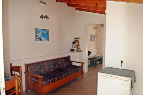 a living room with a couch and a table at Dimitris studios in Kokkari