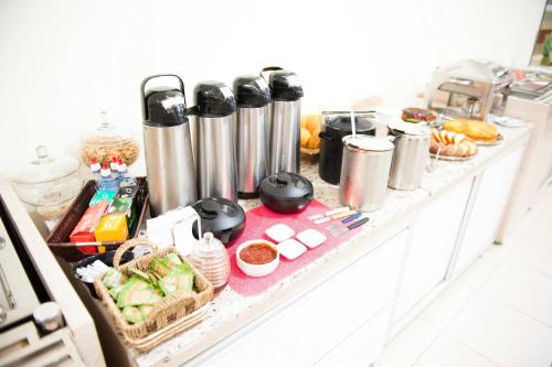 a kitchen counter with a bunch of food on it at Italian Palace Hotel in Palmas
