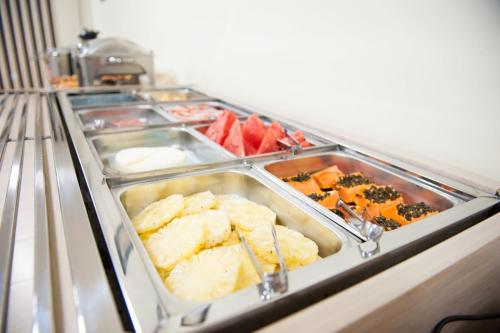 a buffet line with many different types of food at Italian Palace Hotel in Palmas