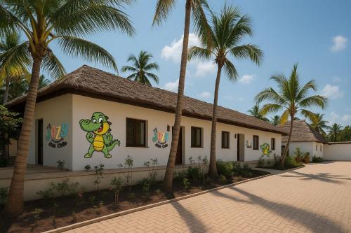 a building with a painting of a frog on it at JAZ Elite Aurora in Michamvi