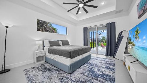 a bedroom with a bed and a swimming pool at Modern Florida Escape in Rotonda West