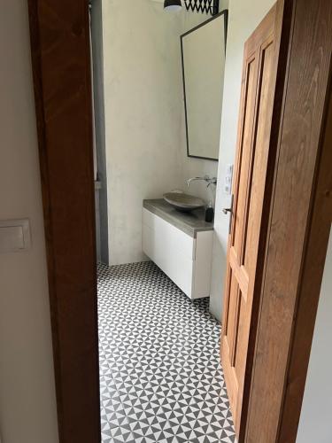 a bathroom with a sink and a mirror at Fara Rejštejn in RejÅ¡tejn